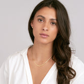 14k Yellow Gold Snake Chain Necklace on woman's neck